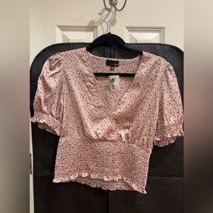 Blush pink and navy blue polka dot blouse